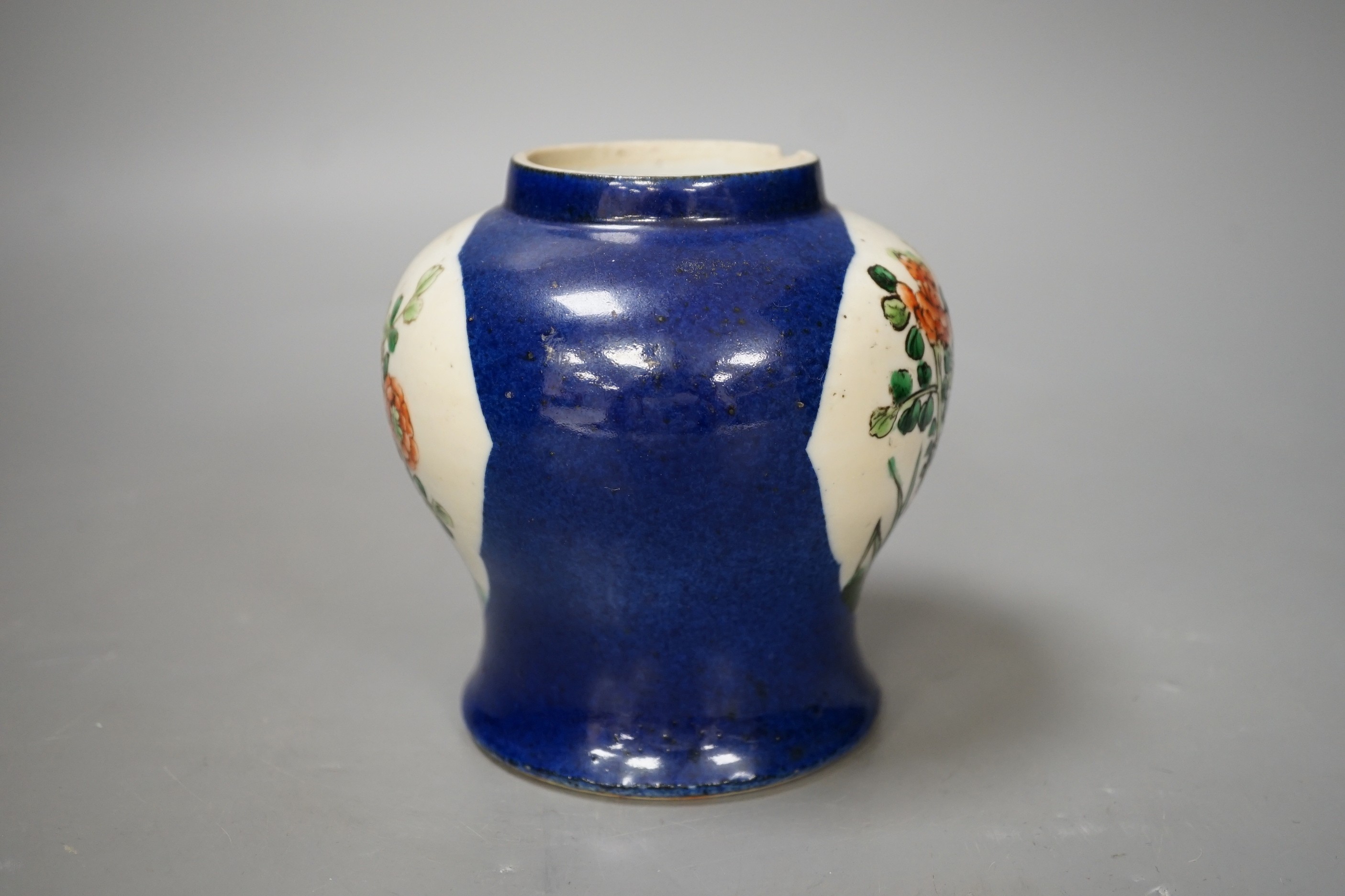 A Chinese powder blue vase, late 19th century, with panelled floral decoration (a.f.). 12cm high